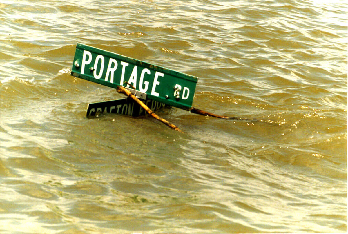 A street sign barely above water in Portage des Sioux, Missouri, in a flood in 1993.