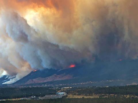 Photo of burning hills surrounding Colorado Springs, CO during the Waldo Canyon Fire.