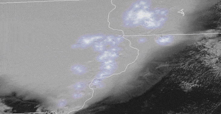 Image captured by NOAA’s GOES-16 weather satellite that shows a long line of storm clouds moving across the Midwest with many flashes of lightning.