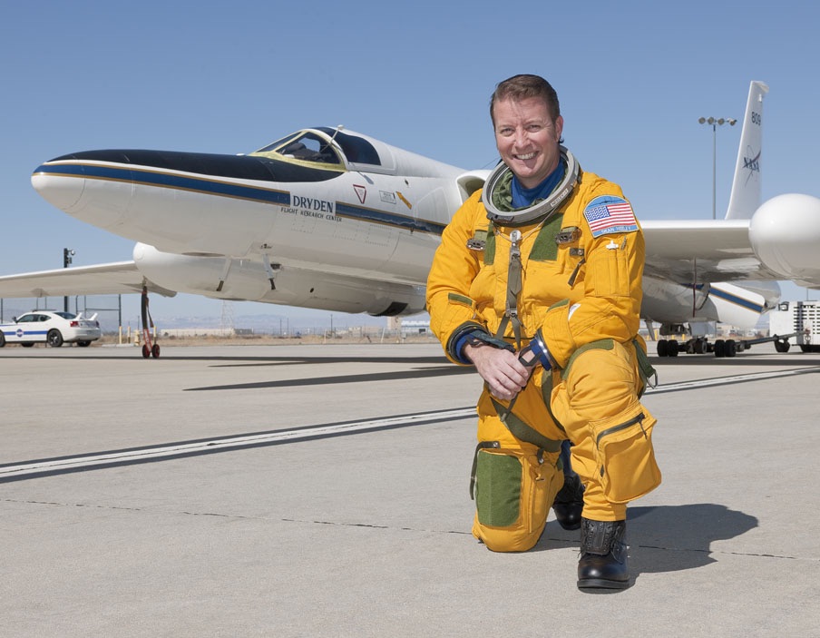 NASA Research Pilot Dean Neeley in front of an ER-2 airplane.
