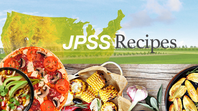 Composite image with platters of food on a table with a field and sky in the background.