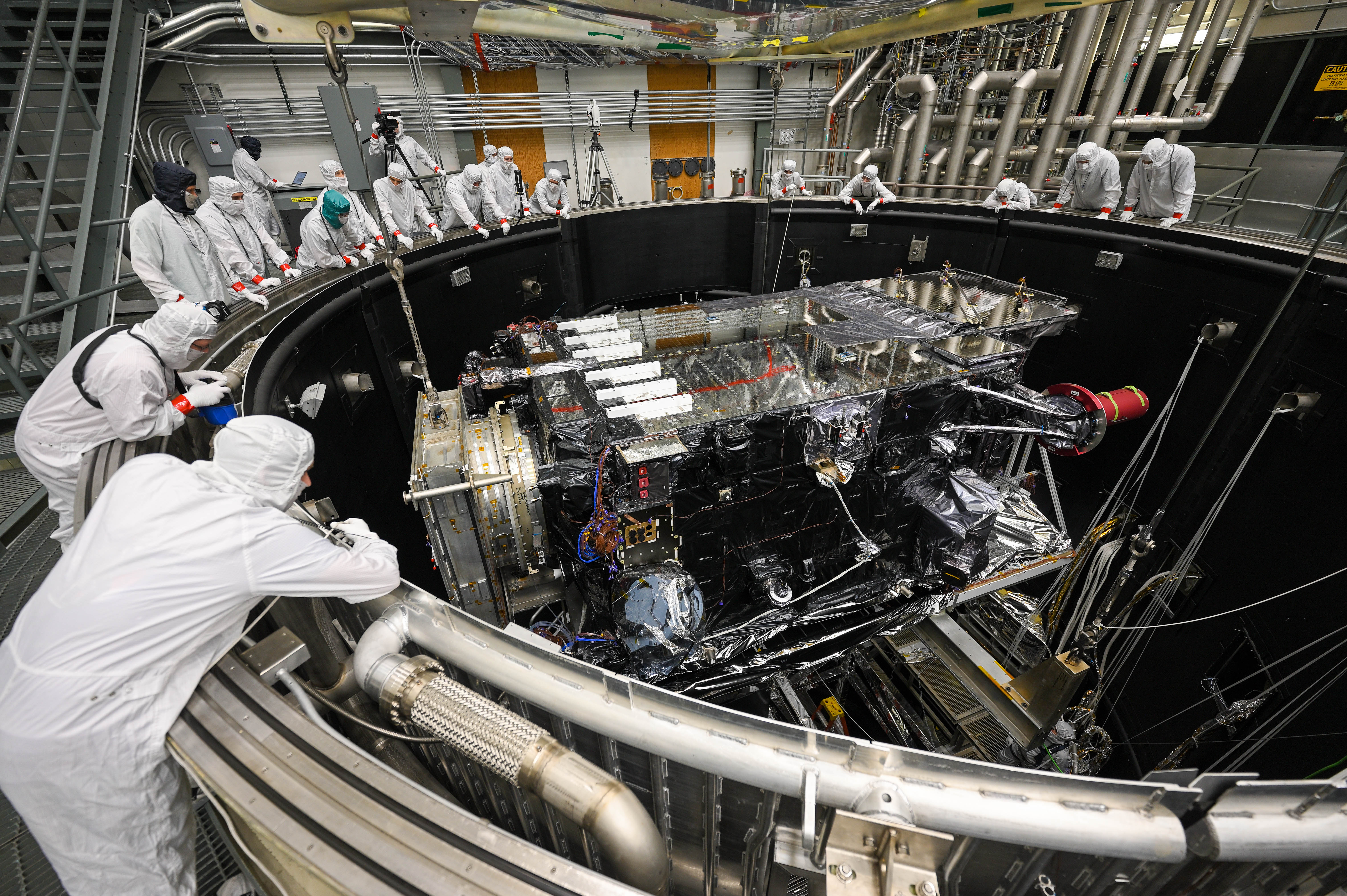 GOES-U is lowered into the thermal vacuum chamber