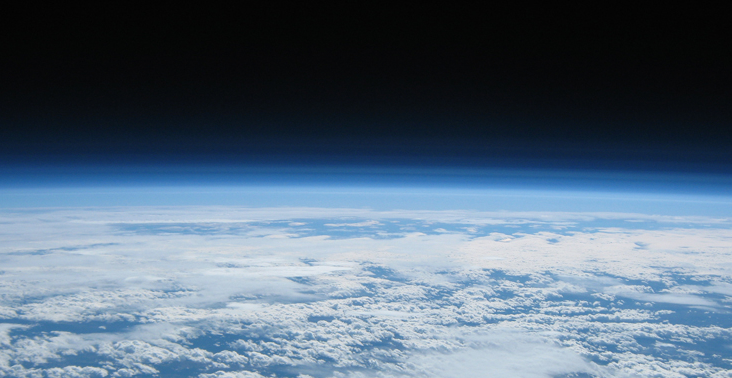 The sky and crest of the earth seen from space. 