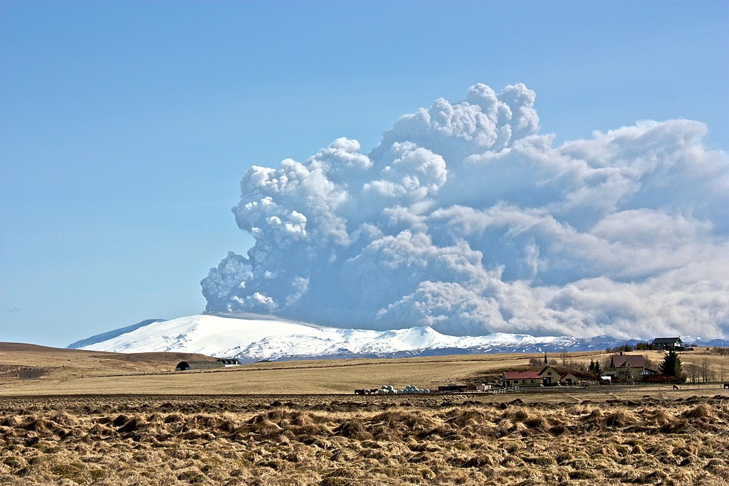 Photo of thick, light gray, billowing clouds of volcanic ash.